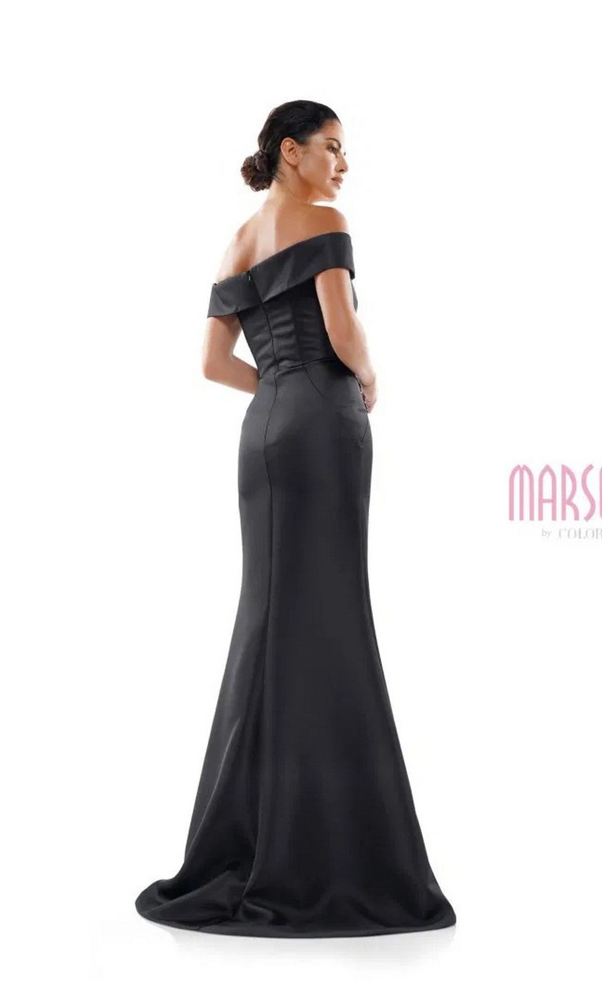 A woman wearing the Marsoni MV1003 long formal dress, featuring an off-the-shoulder satin design with a fitted bodice and subtle beaded floral accents, stands against a plain white background.